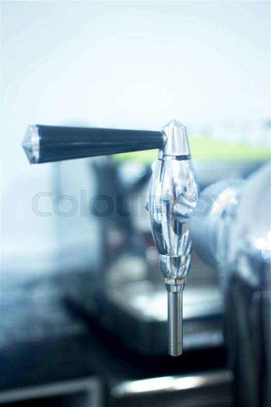 Draught beer pump tap in pub bar photo, stock photo