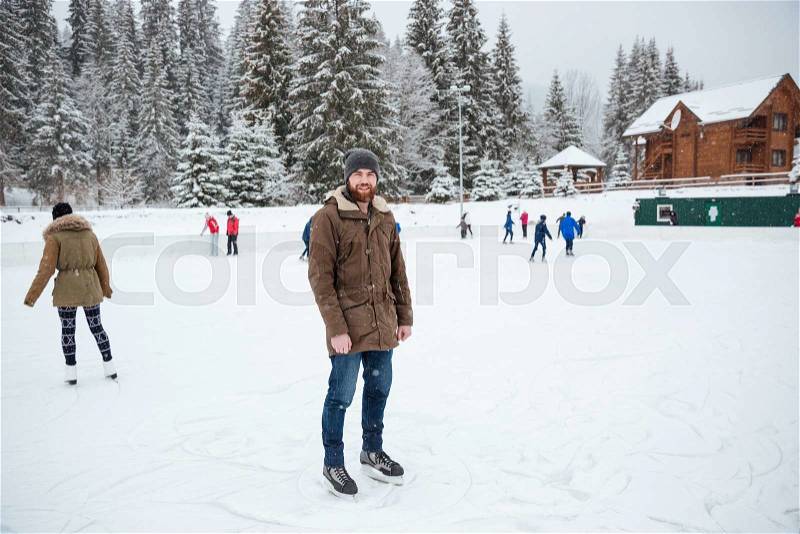Portrait of a man ice skating outdoors, stock photo