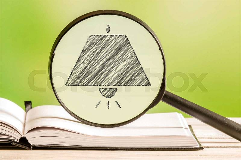 Lamp search with a pencil drawing of a pendant in a magnifying glass, stock photo