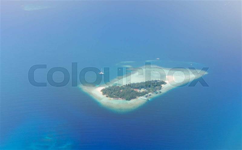 Travel, tourism, vacation and summer holidays concept - Maldive island in ocean, stock photo