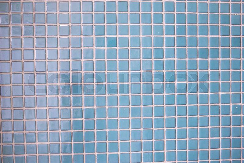 Blue mosaic tiles texture with white filling, stock photo