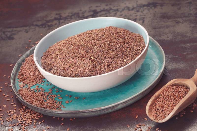 Whole flaxseed and ground flaxseed, stock photo