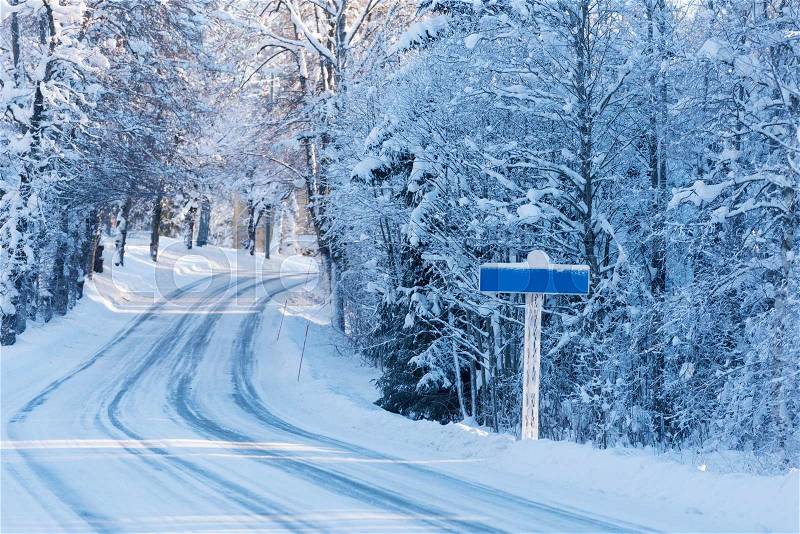 Road sign on winter road, empty, stock photo