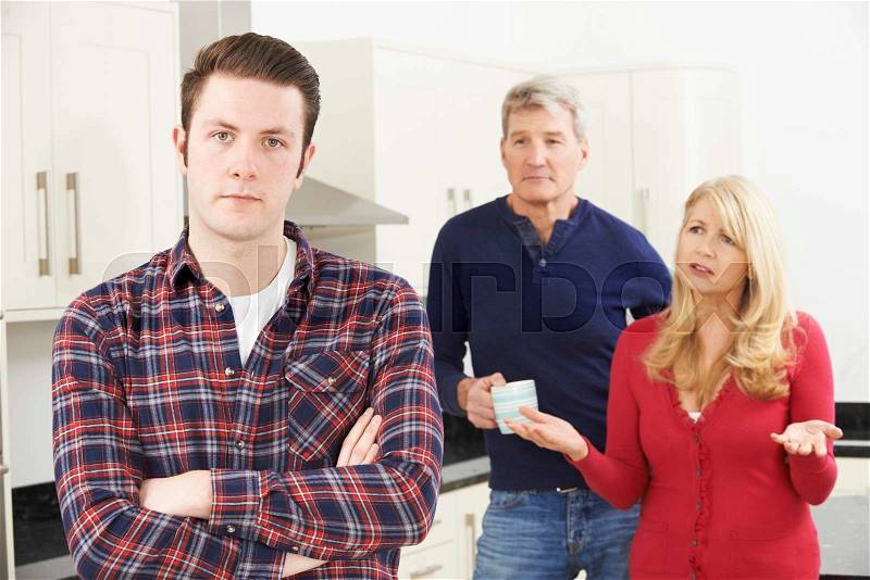 Mature Parents Frustrated With Adult Son Living At Home, stock photo