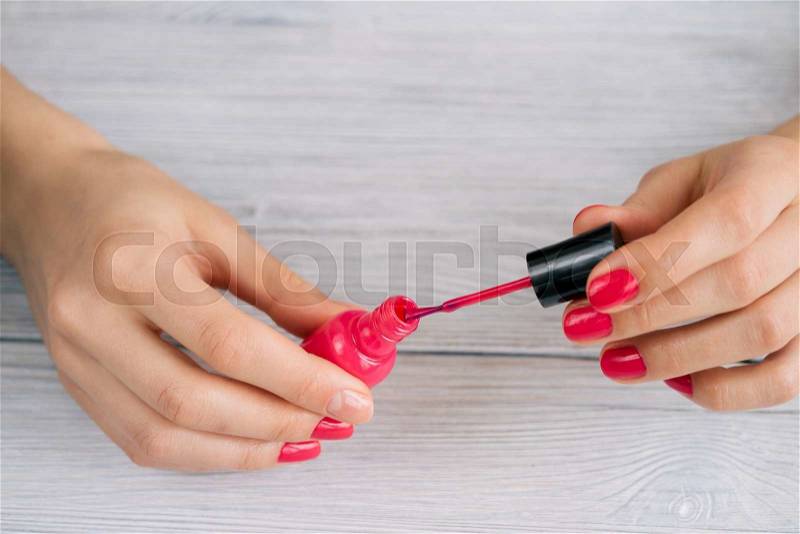 Women\'s hands painted nails with red lacquer, stock photo