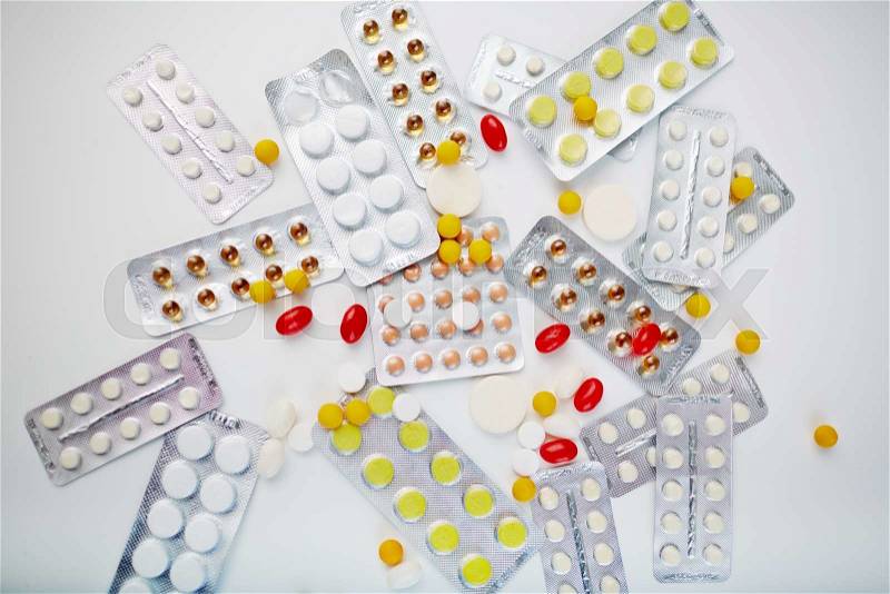 Assortment of colorful pills and vitamins, stock photo