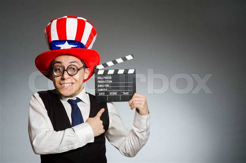 Man with american hat and movie board, stock photo