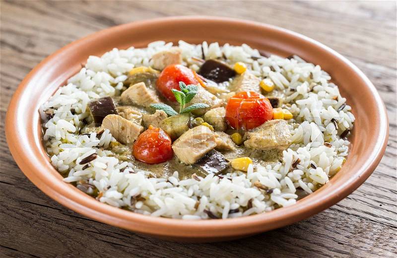 Thai green chicken curry with mix of white and wild rice, stock photo