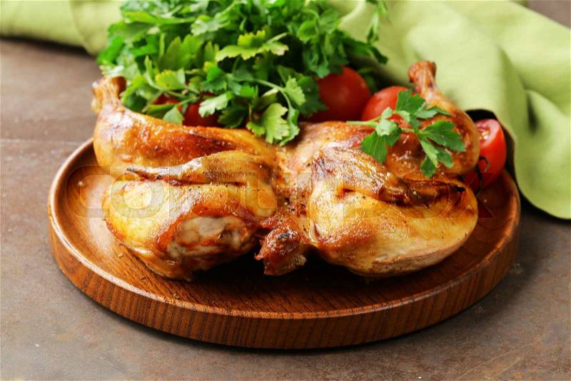 Grilled whole chicken with herbs and spices, stock photo