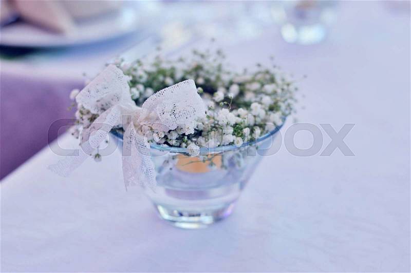 Table decor with flowers table numbers and candles , stock photo