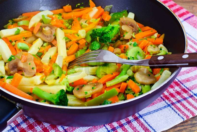 Steamed Vegetables Potatoes, Carrots, Onion and Mushrooms Studio Photo, stock photo