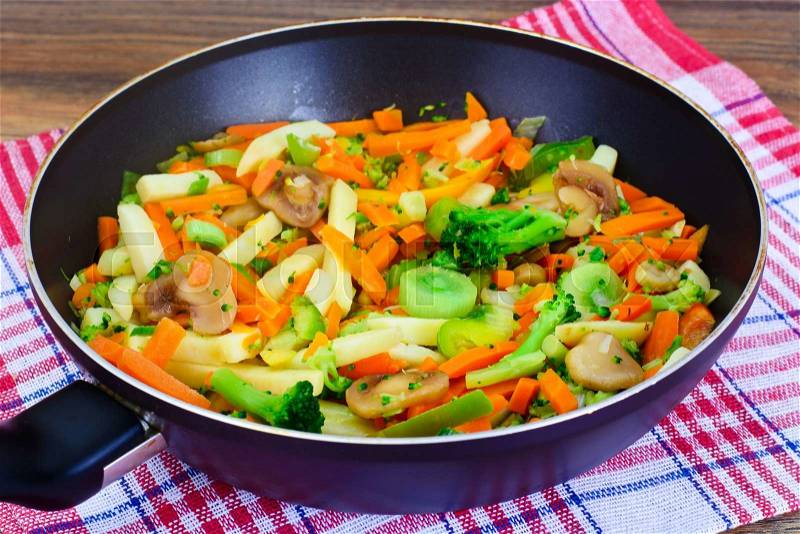 Steamed Vegetables Potatoes, Carrots, Onion and Mushrooms Studio Photo, stock photo
