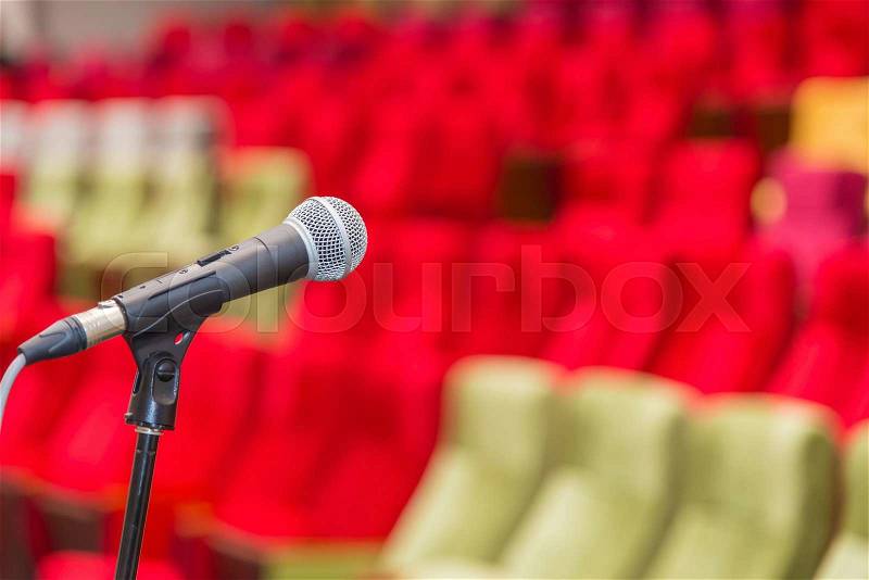 Close up of microphones in theatre or conference hall, stock photo