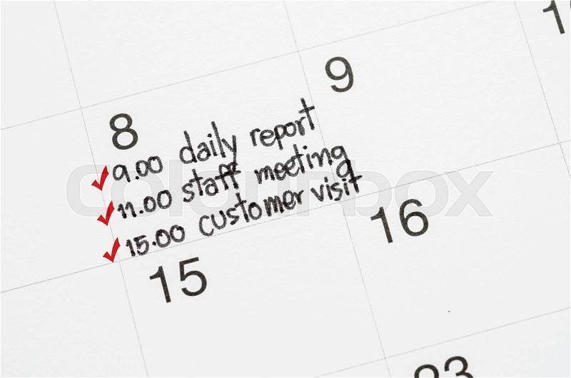 The red check mark with to do list on page calendar. Busy day concept, stock photo