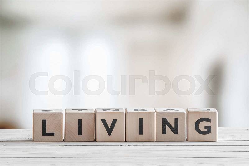 Cubes with the word living on an indoor table, stock photo