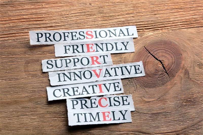 Service acronym in business concept, words on cut paper on wooden background, stock photo