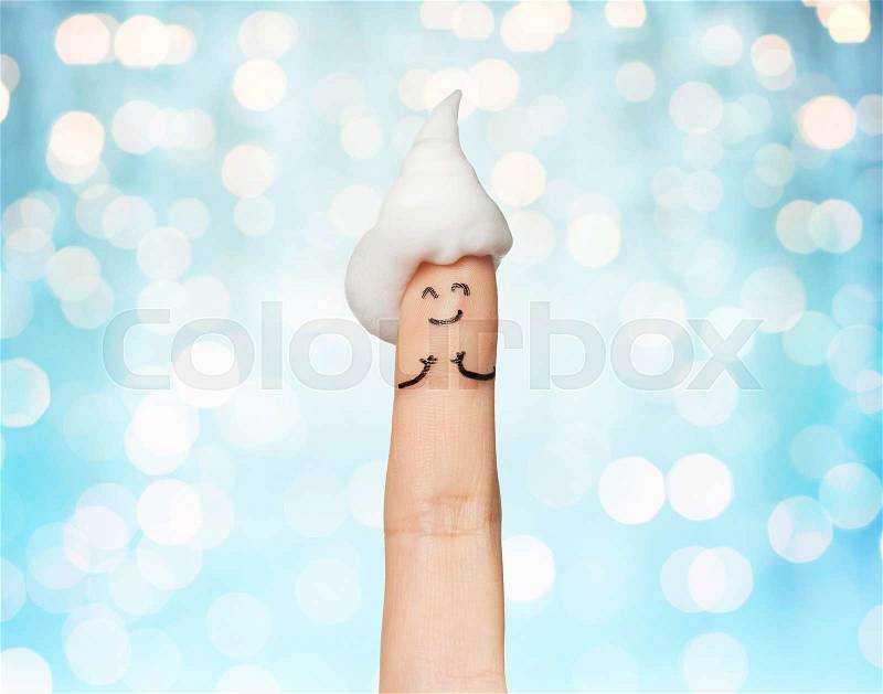 Gesture, bath time and body part concept - close up of one finger up with bath foam or whipped cream over blue holidays lights background, stock photo