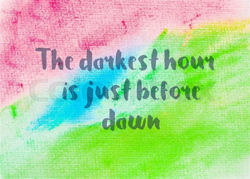 The darkest hour is just before dawn. Inspirational quote over abstract water color textured background, stock photo