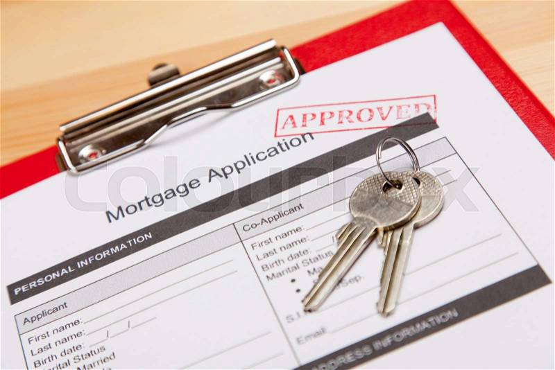Mortgage application form and keys, stock photo