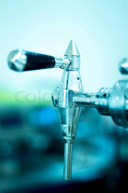 Draught beer pump tap in pub bar photo, stock photo