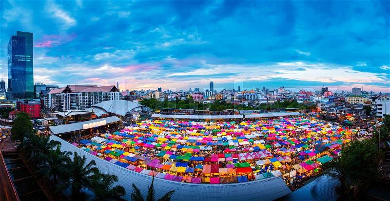 Panorama aerial view of Multi-colored tents in Rod-Fai market (second-hand market) at twilight, Bangkok, Thailand, stock photo