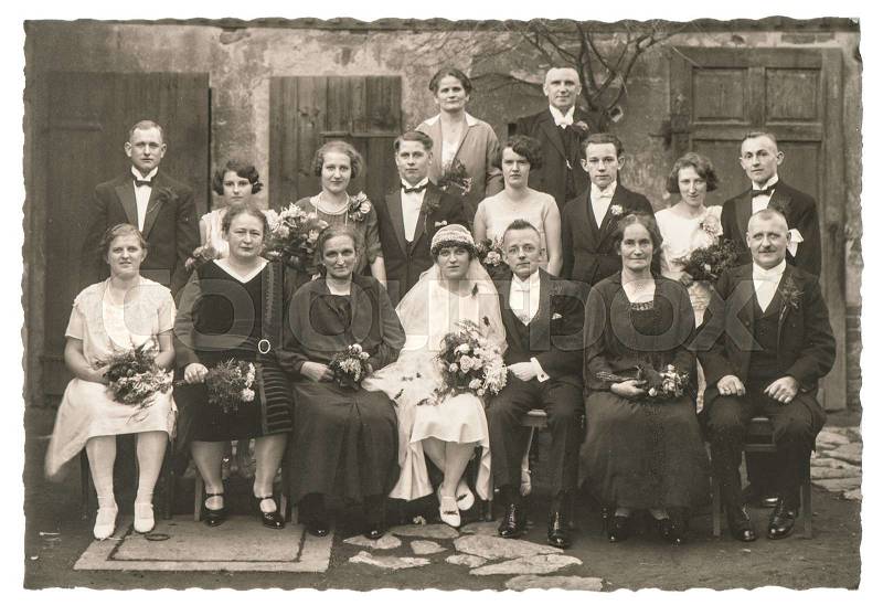 BERLIN, GERMANY - CIRCA 1936: Old family wedding photo. People wearing vintage clothing. Antique fashion dress, stock photo