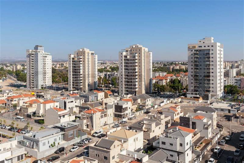 Contemporary residential buildings and houses in new neighborhood of Kiryat Gat - city in southern district of Israel, stock photo