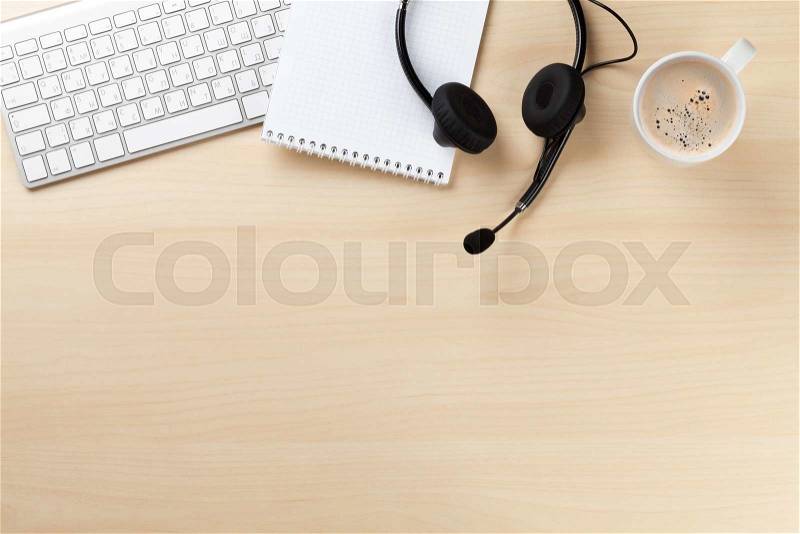 Office desk with headset and pc. Call center support table. Top veiw with copy space, stock photo