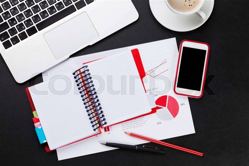 Office leather desk table with laptop, coffee cup, smartphone and reports. Top view with copy space, stock photo