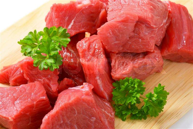Raw diced beef on cutting board, stock photo