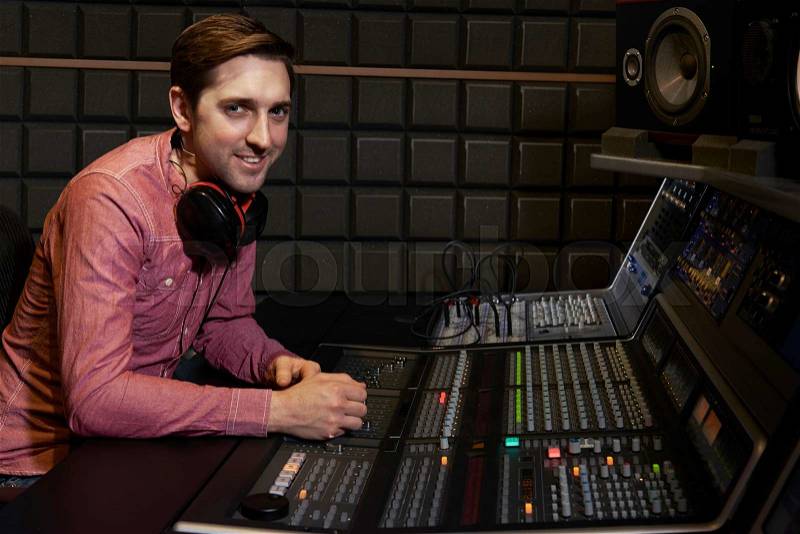 Portrait Of Sound Engineer In Recording Studio, stock photo