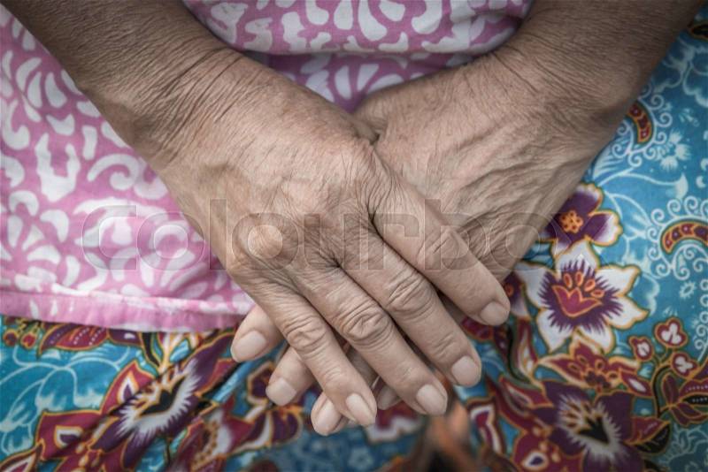 Aging process - very old senior woman hands wrinkled skin, stock photo