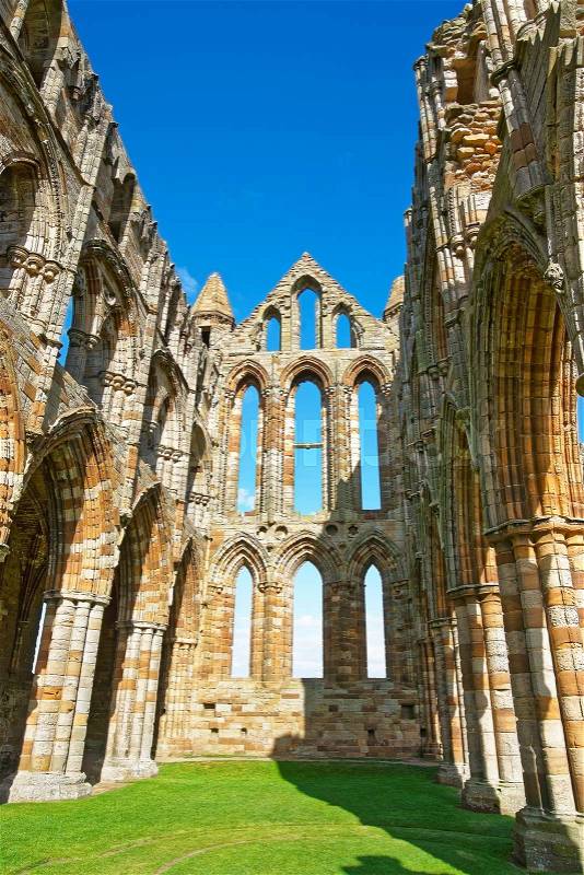 Ruined inner walls to Whitby Abbey in North Yorkshire in England. It is ruins of the Benedictine abbey. Now it is under protection of the English Heritage, stock photo