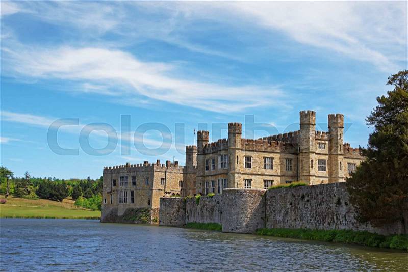Leeds Castle in a lake in Kent in England. The castle was built in the twelfth century as a king residence. Now it is open to the public, stock photo