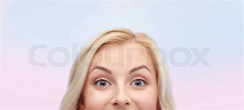 Curiosity, advertisement and people concept - happy young woman or teenage girl face over rose quartz and serenity gradient background, stock photo