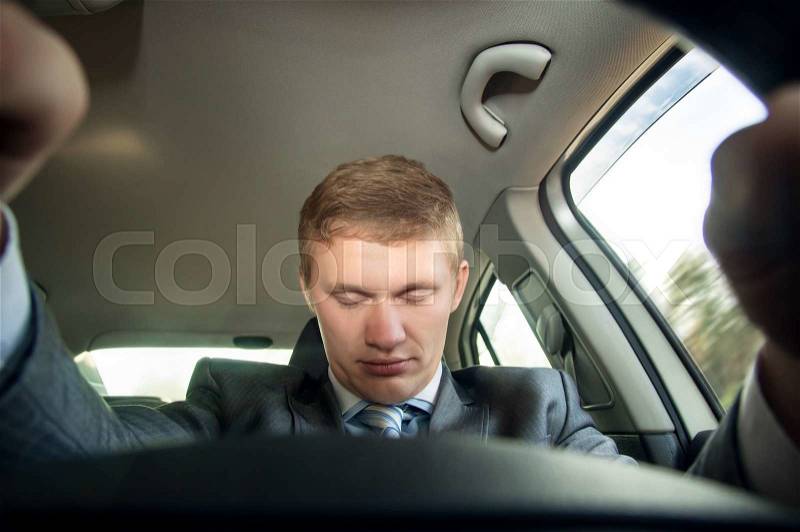 Driver fell asleep at the wheel of a car while driving, stock photo