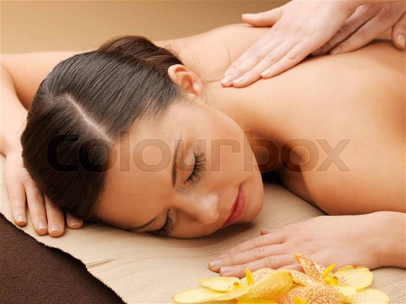 Picture of calm beautiful woman in massage salon, stock photo