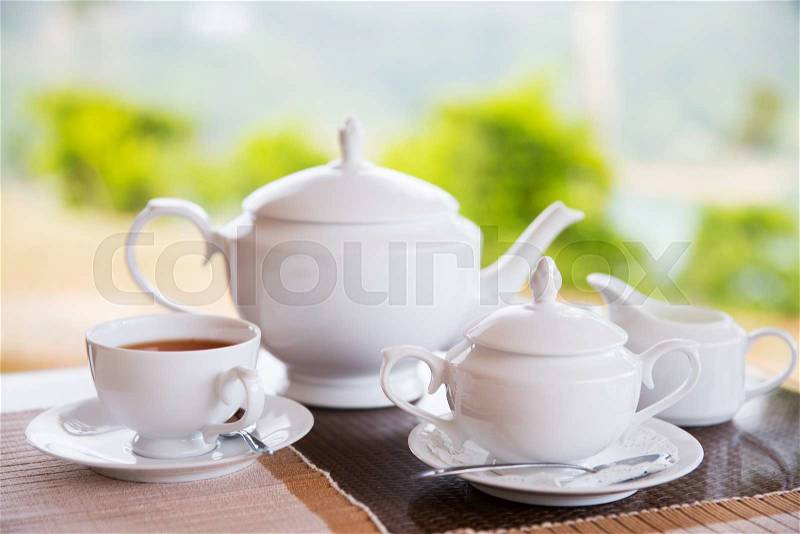 Teatime, drink and object concept - close up of tea service on table at restaurant or teahouse, stock photo
