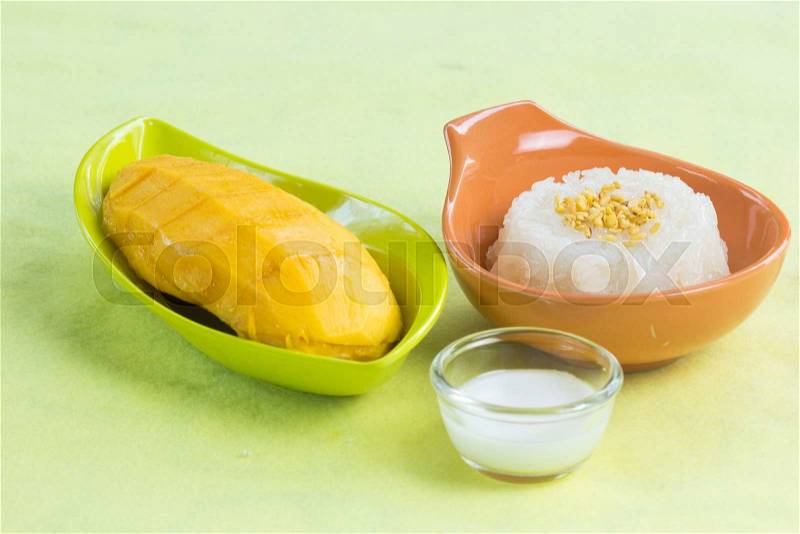 Sticky rice cooked with coconut milk and mango /Thai style dessert, stock photo