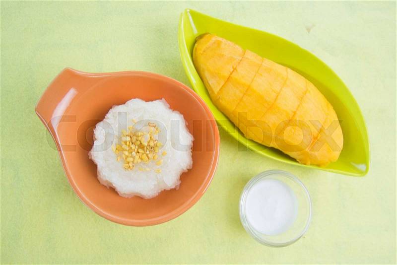 Sticky rice cooked with coconut milk and mango /Thai style dessert, stock photo