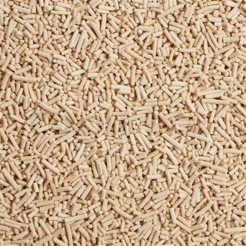 Surface covered with the dry yeast as a background texture composition, stock photo