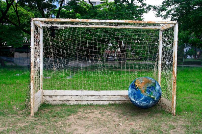 The earth on soccer goal, including elements furnished by NASA, stock photo