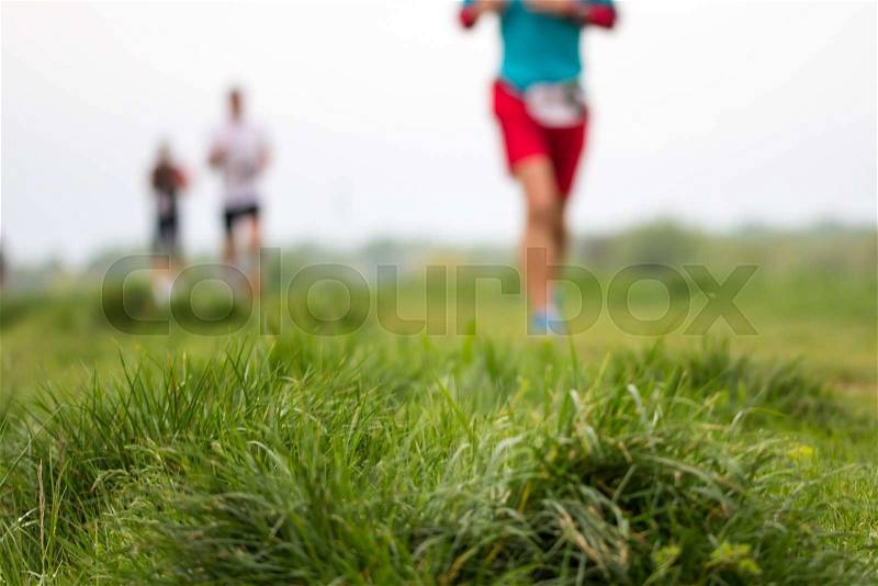 Outdoor marathon cross-country running fitness and healthy lifestyle, blurred motion, stock photo