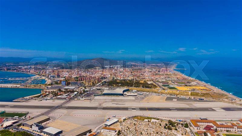 Gibraltar city and airport runway and La Linea de la Concepcion in Spain, stock photo