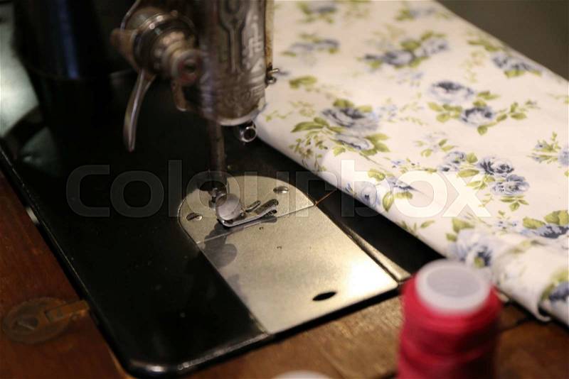 Classic fabric and sewing machine, stock photo