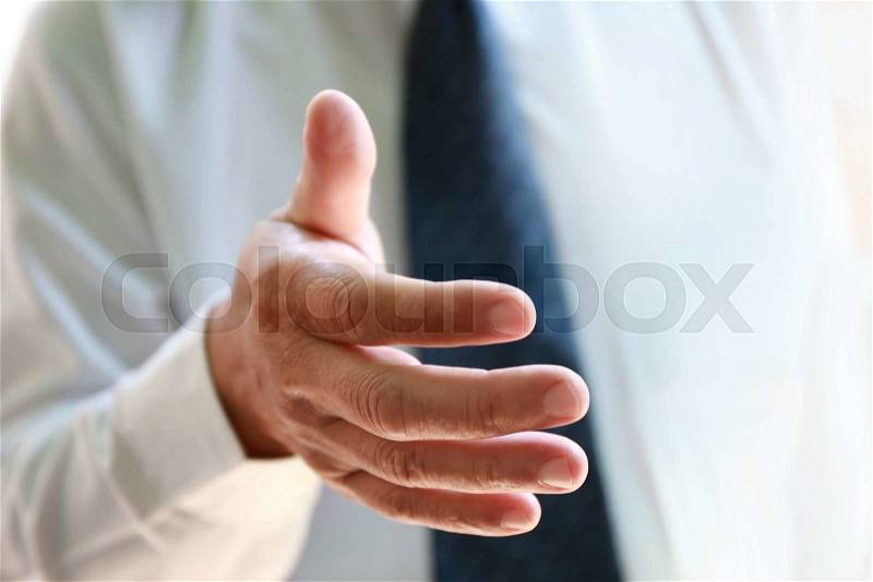 Businessman reach hand for handshake, stock photo