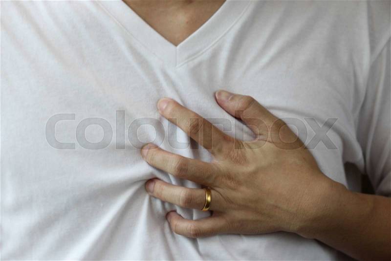 Hand hold on chest, heart attack, stock photo