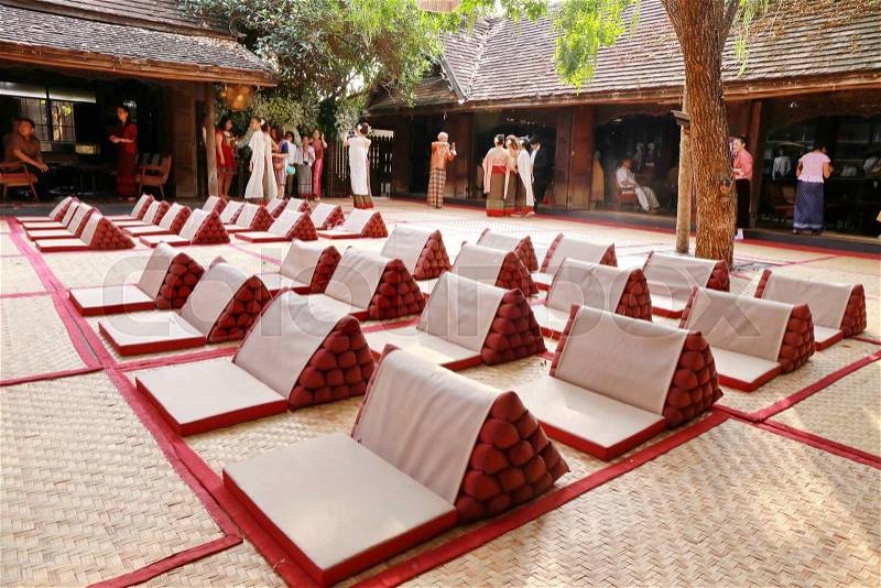 Triangle pillow on wood house ground, welcome culture event at Chiang Mai, Thailand, stock photo