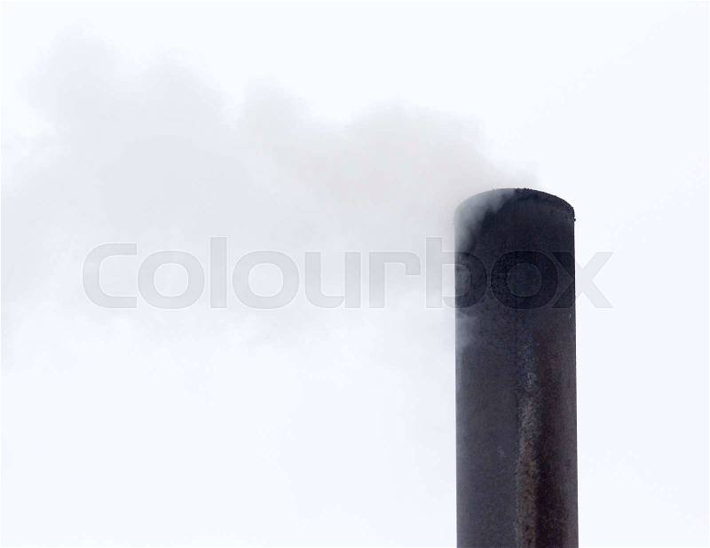 Smoke from a pipe on a cloudy sky, stock photo