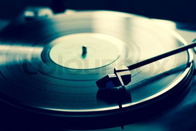 Vintage record player with vinyl disc, close-up, stock photo